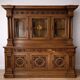 Two-body buffet, made of richly carved solid walnut.