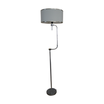 Flexible floor lamp, chrome, opaque white shade with metallic edges.