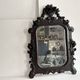 Napoleon III mirror in carved blackened wood, 19th century
