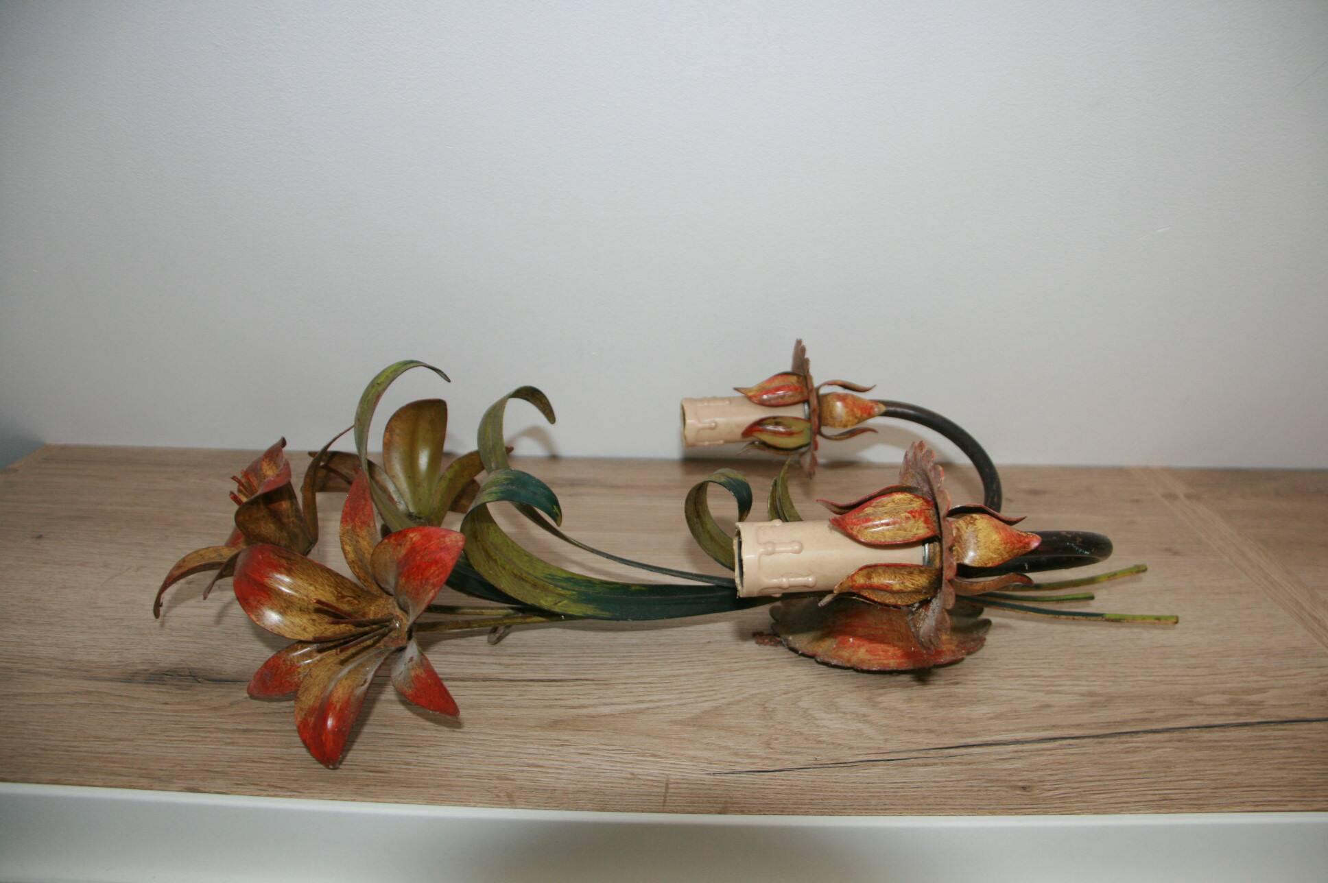 Pair of vintage floral wall sconces in Italian Florentine style metal.