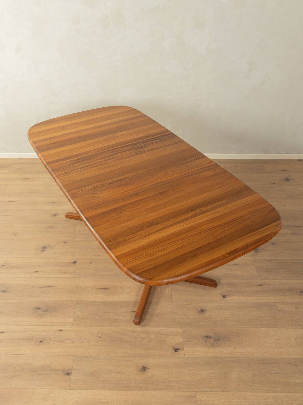 Glostrup dining table, 1980s, solid teak, by Johs. Kristoffersen & Søn, with two extension leaves