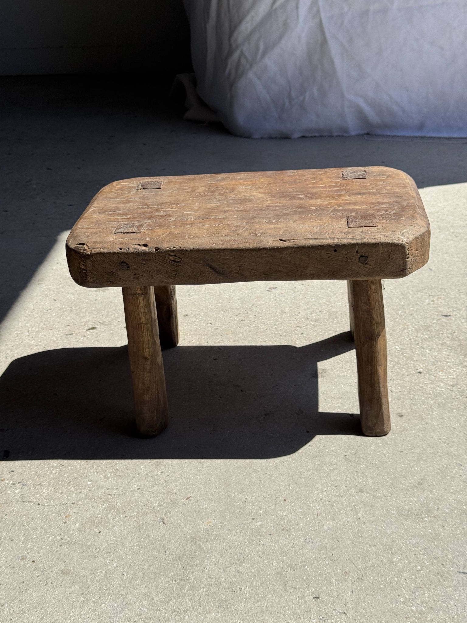 Small stool, rectangular rounded solid teak side table.