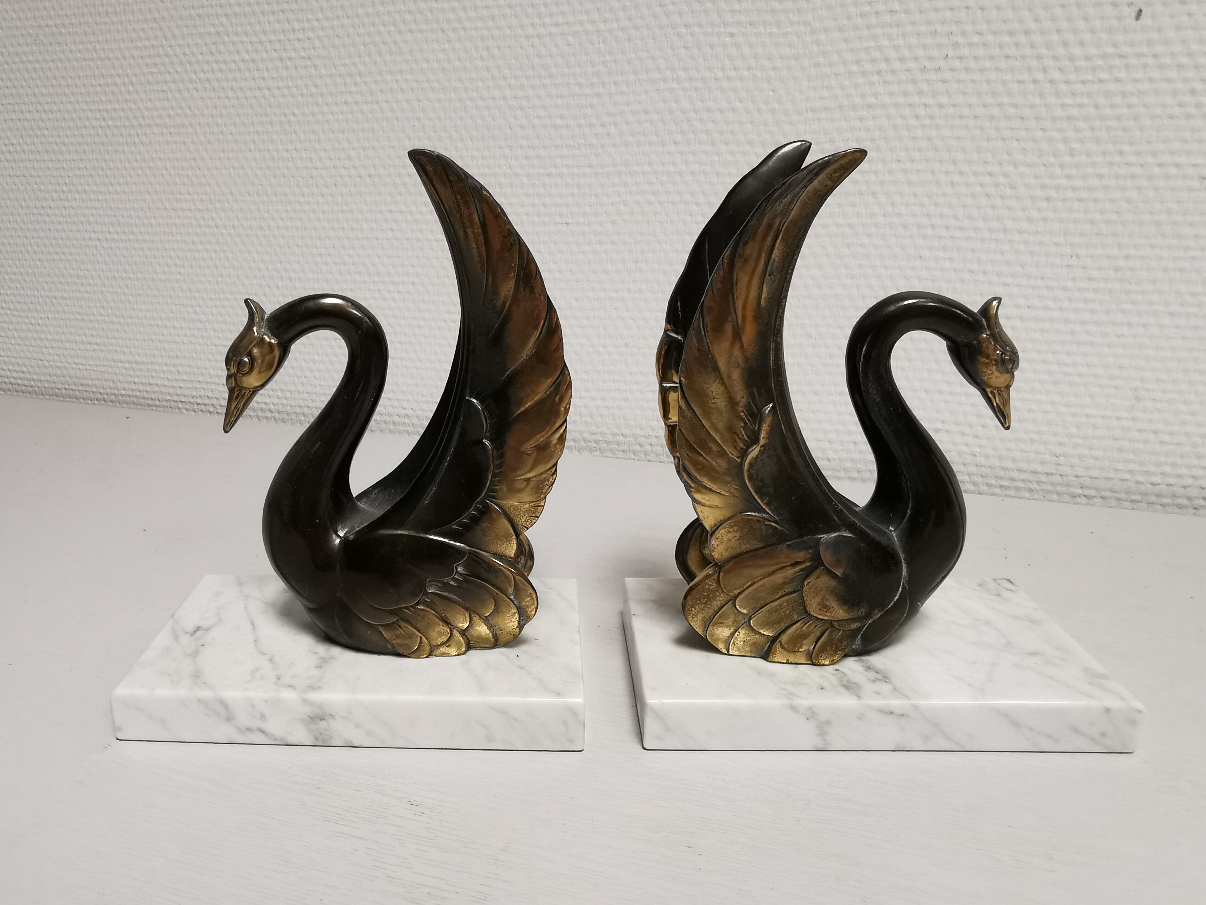 Pair of ancient zoomorphic bookends, swan statues