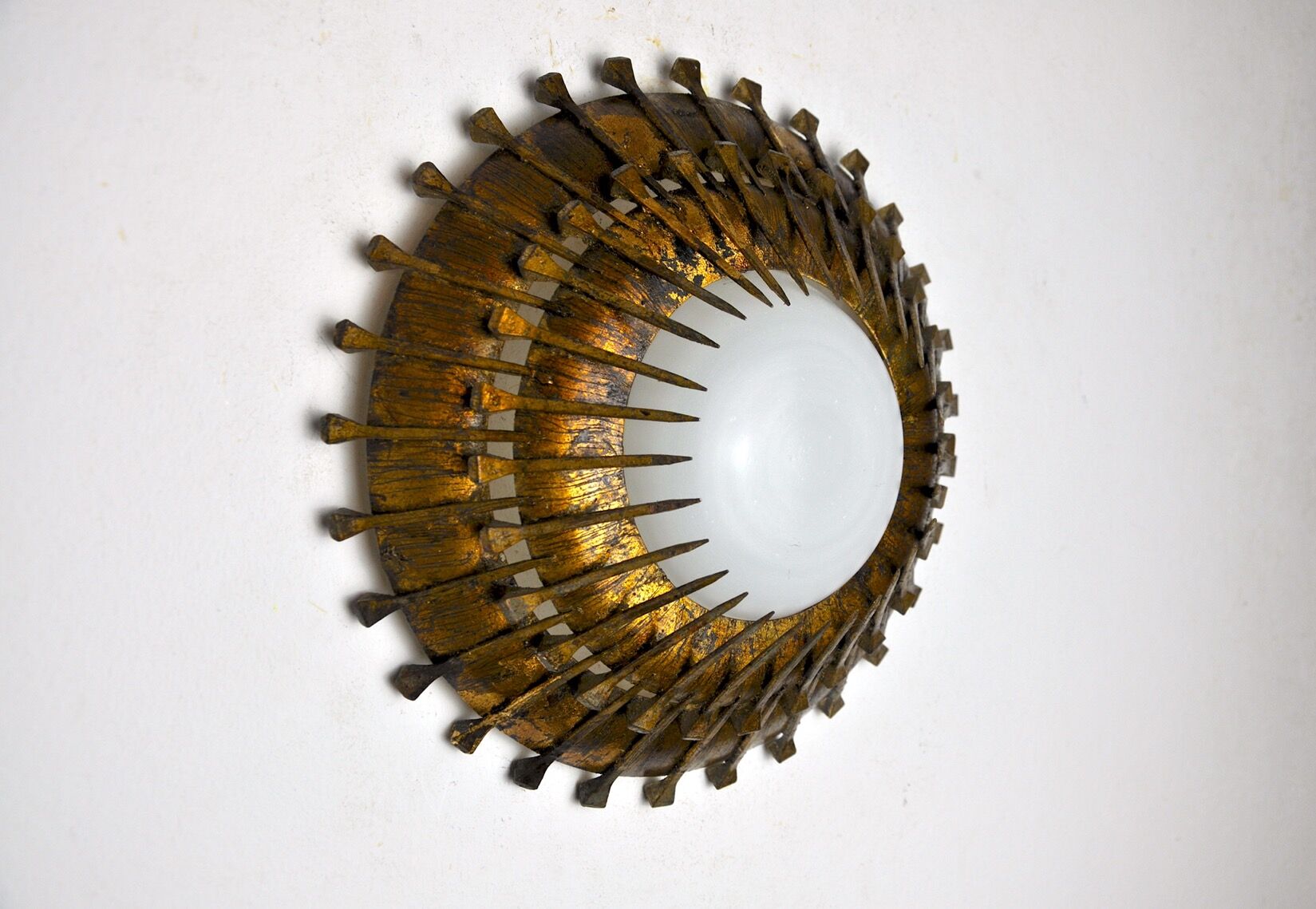 Midcentury brutalist sun wall lamp, metal and gold leaf, Italy