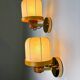 Pair of articulated "Cocoon" wall lights, resin and pine, Italy, circa 1970s