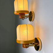 Pair of articulated "Cocoon" wall lights, resin and pine, Italy, circa 1970s