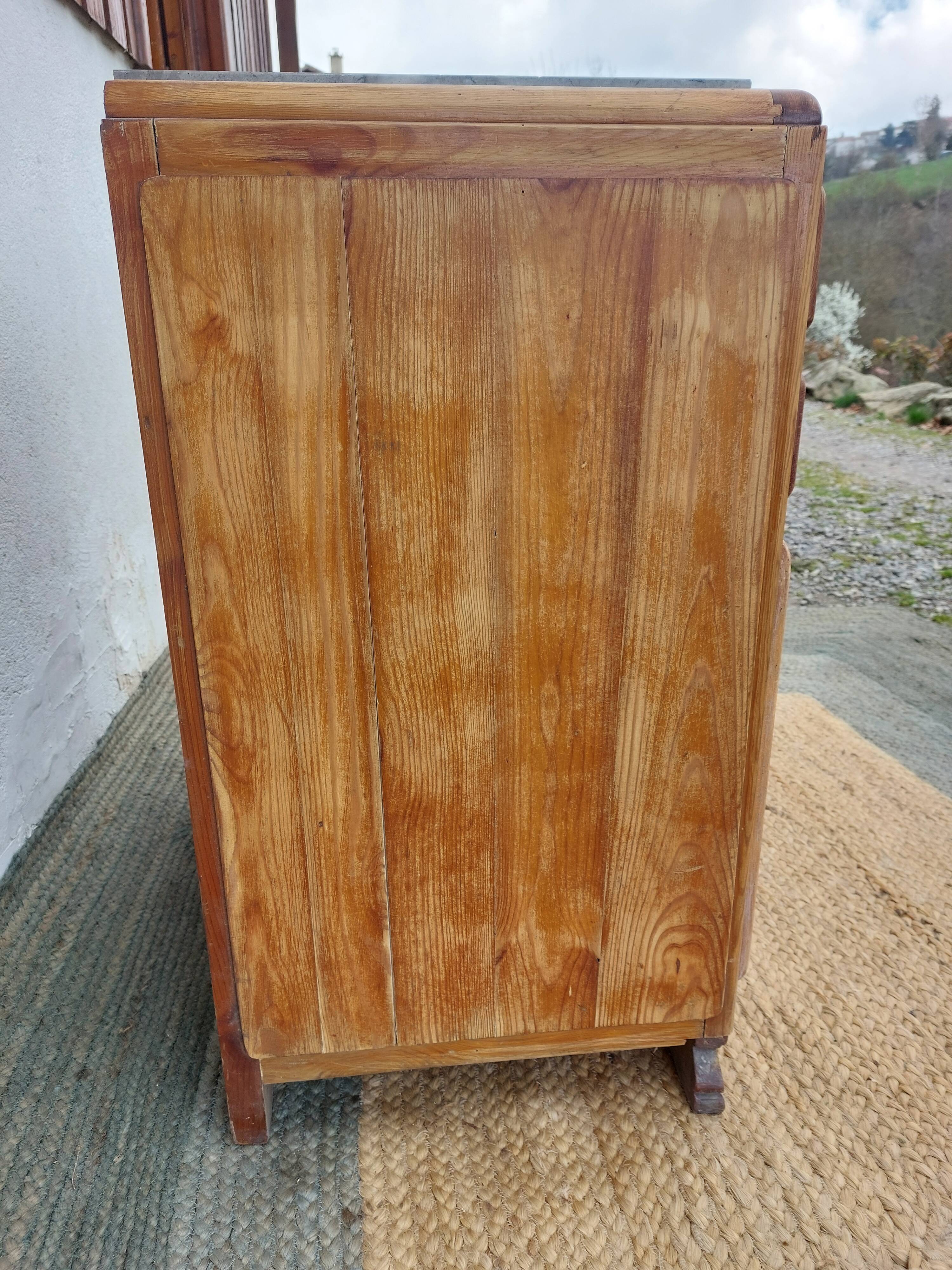 Vintage wooden buffet with a marble top.
