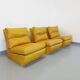Suite de 3 chauffeuses Roche Bobois vintage en cuir jaune moutarde années 70