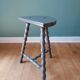 Bluish-grey tripod stool