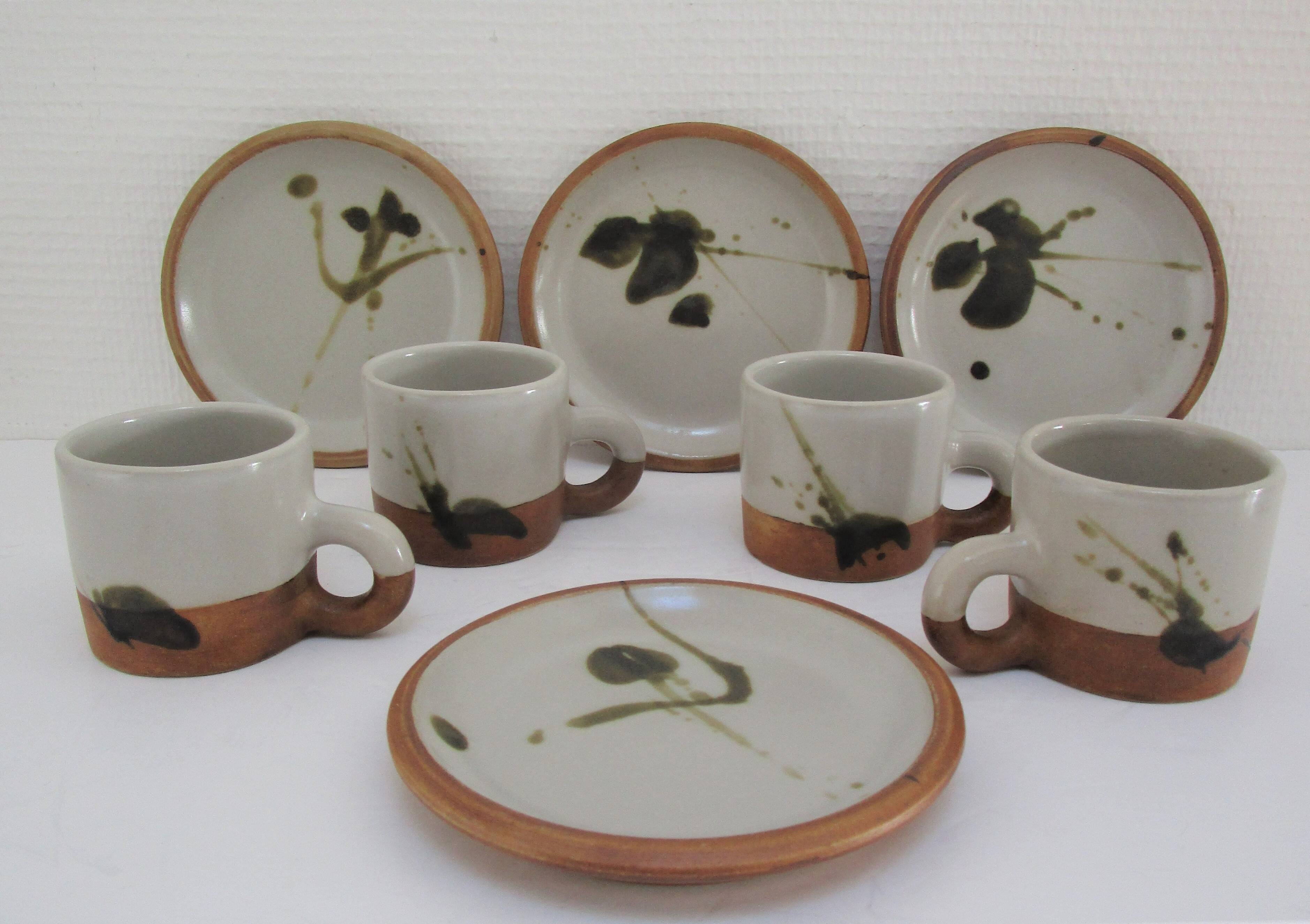 Four pottery cups and saucers from La Colombe Vallauris