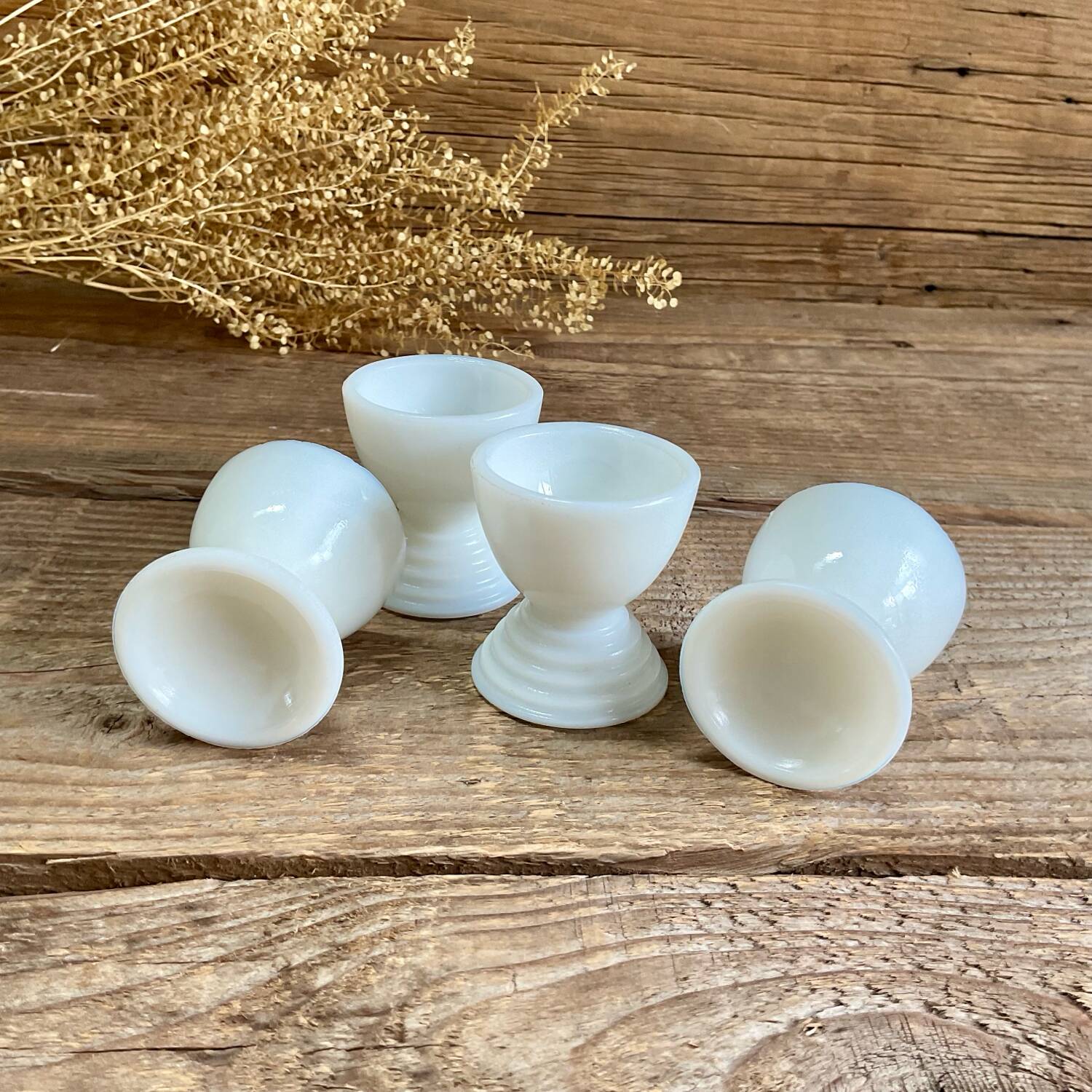 4 egg cups in white opaline glass