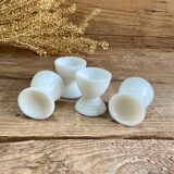 4 egg cups in white opaline glass