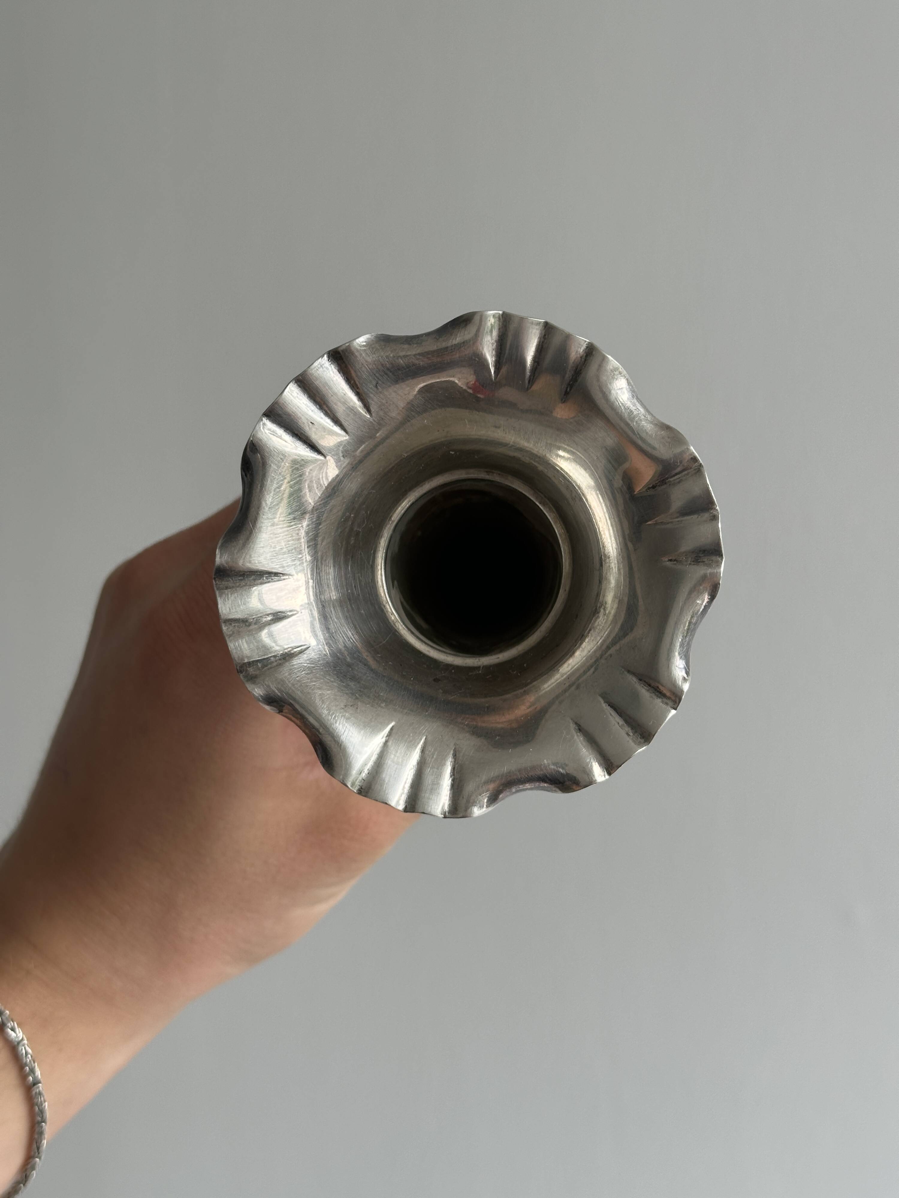 Pair of shiny silver metal vases