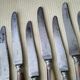 Box of 12 antique cheese or dessert knives. Steel and bovine horn.