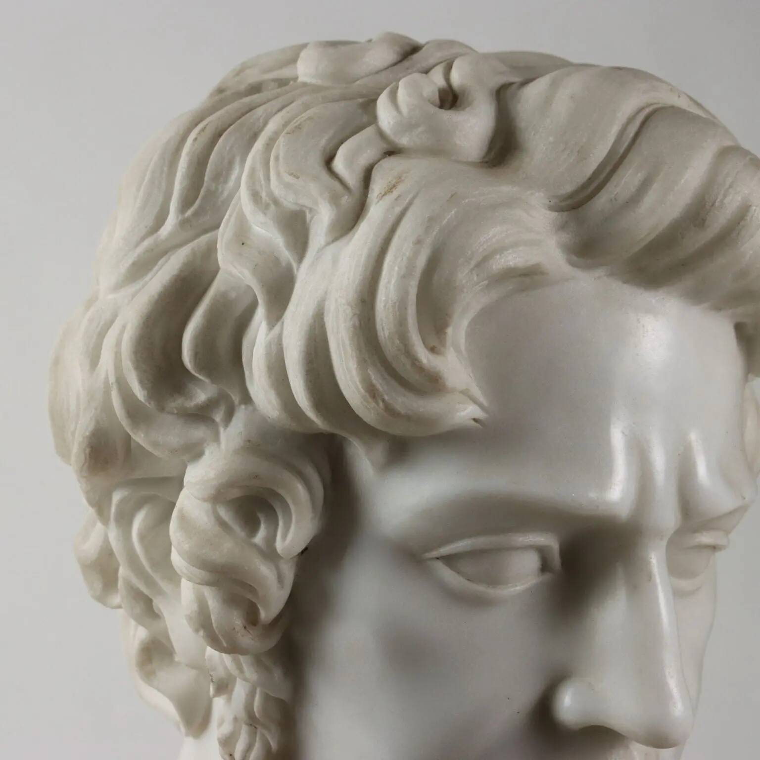 Bust of a Roman emperor in white marble, Italy, 20th century.