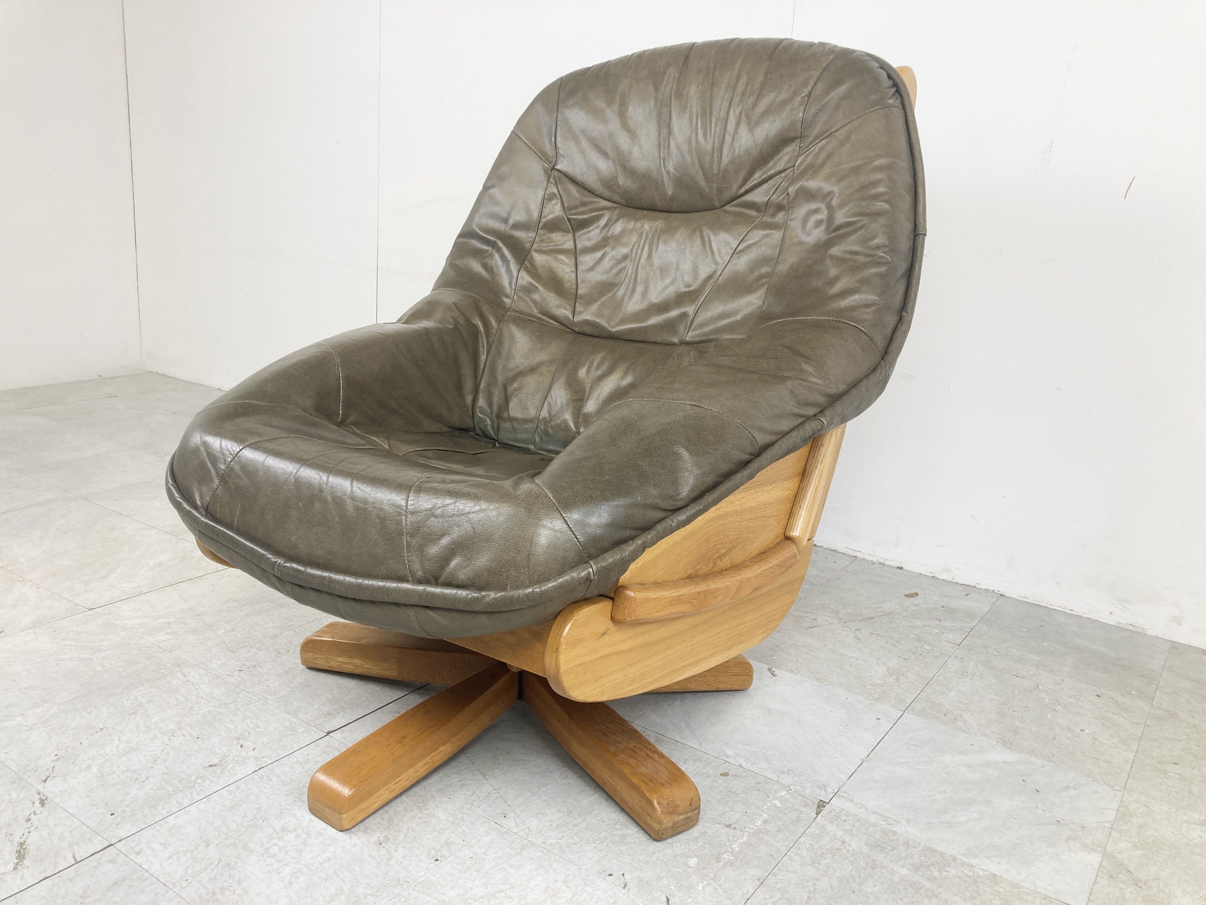Brutalist oak and leather swivel chair, 1970s
