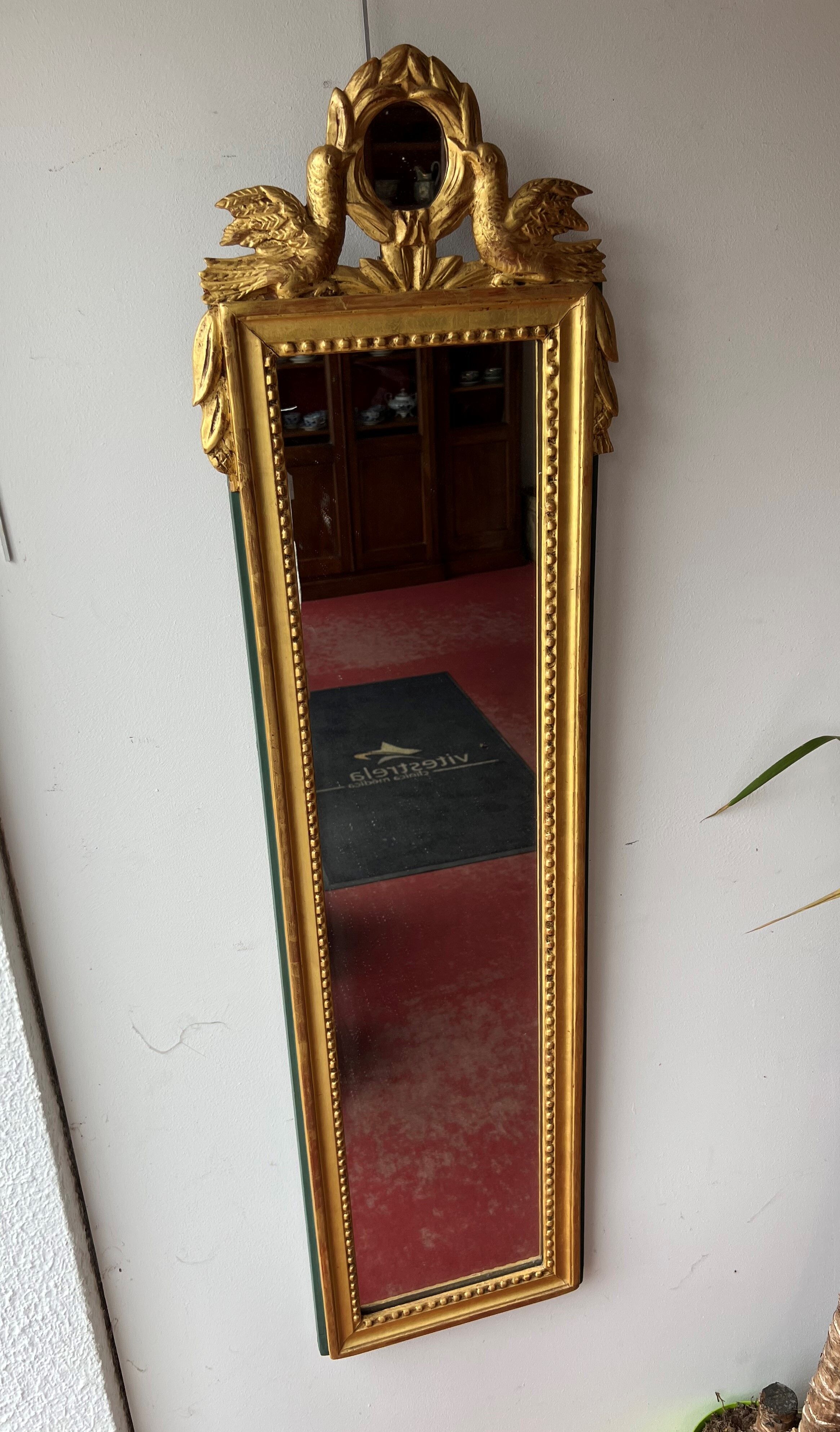 Mirror between two Louis XVI style in gilded wood with leaf around 1900