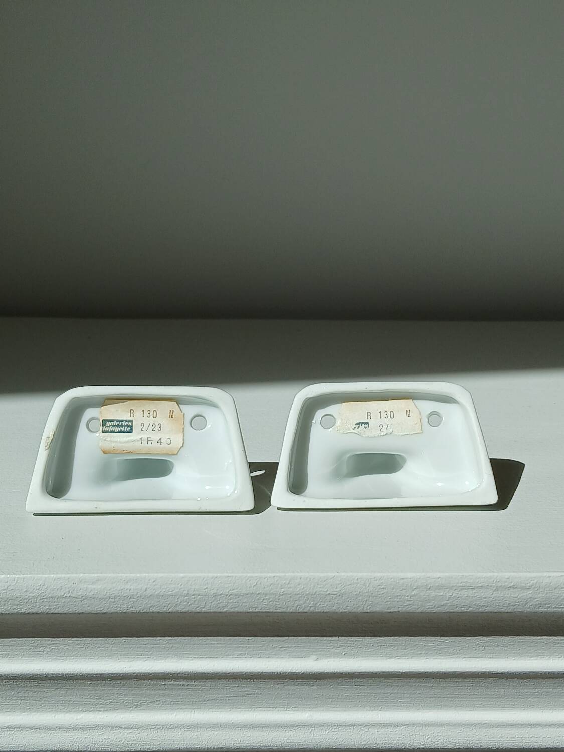 Set of two porcelain tea towel holders