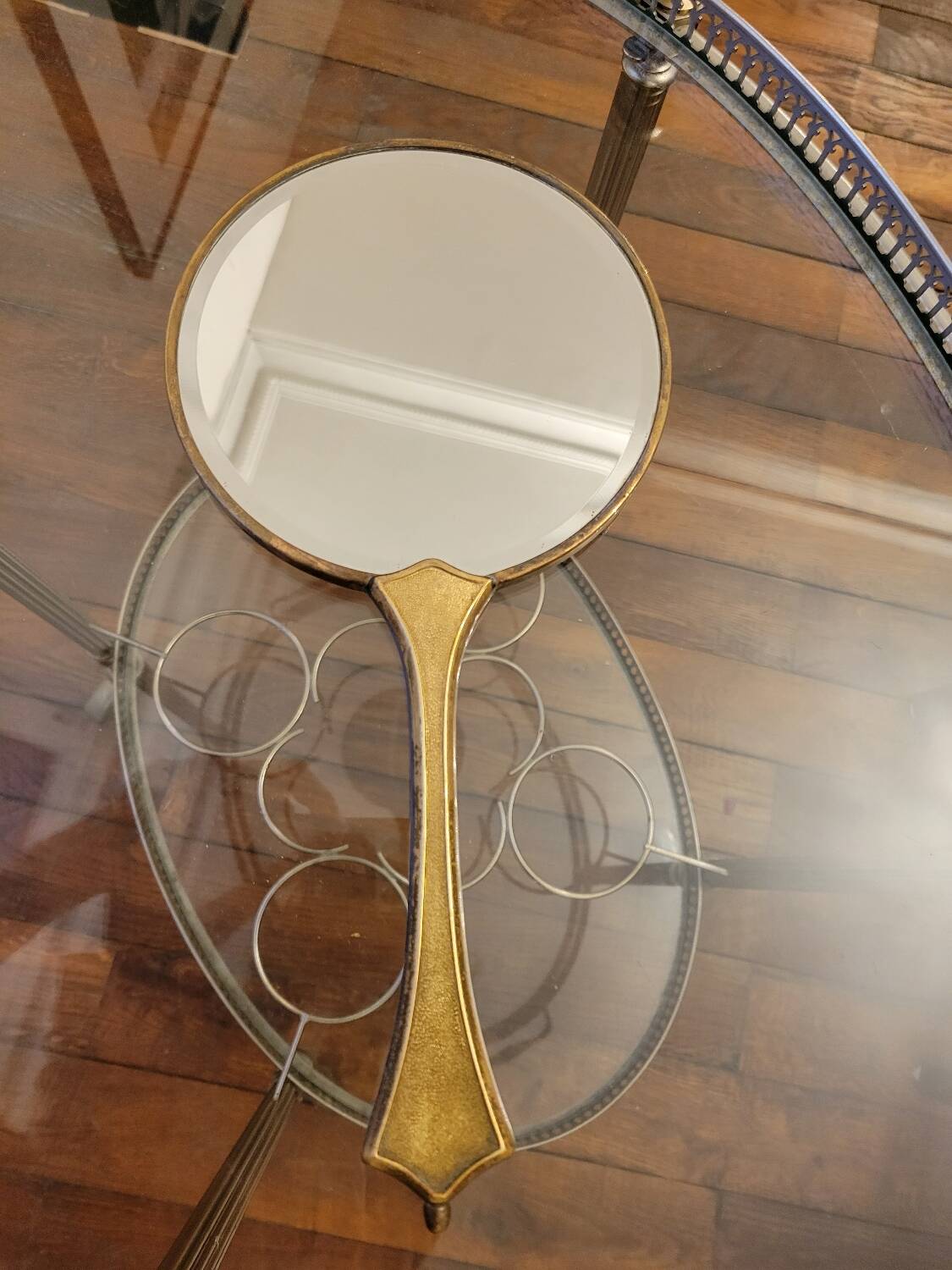 Brass hand mirror with magnifying back