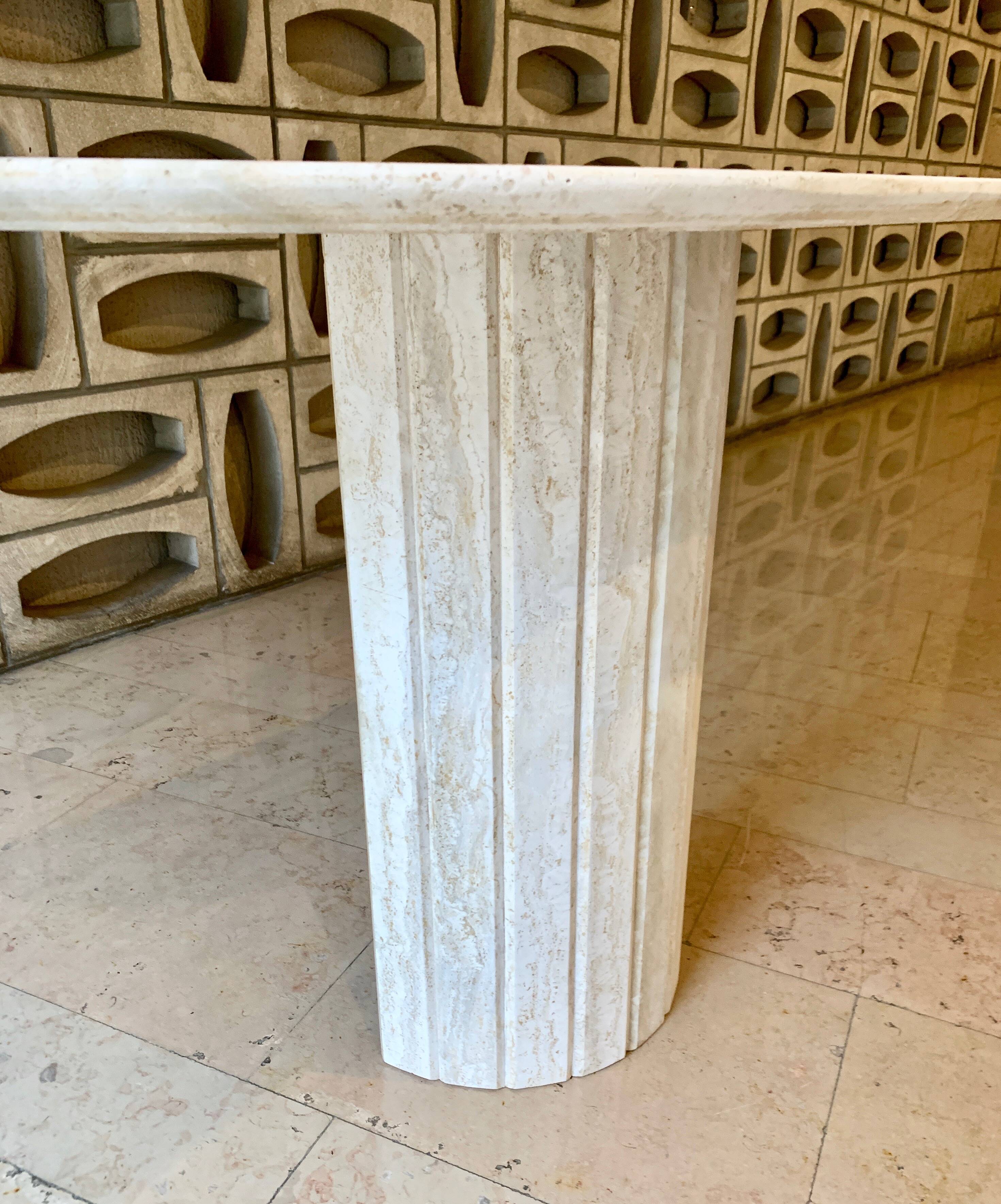 Travertine console with canted foot