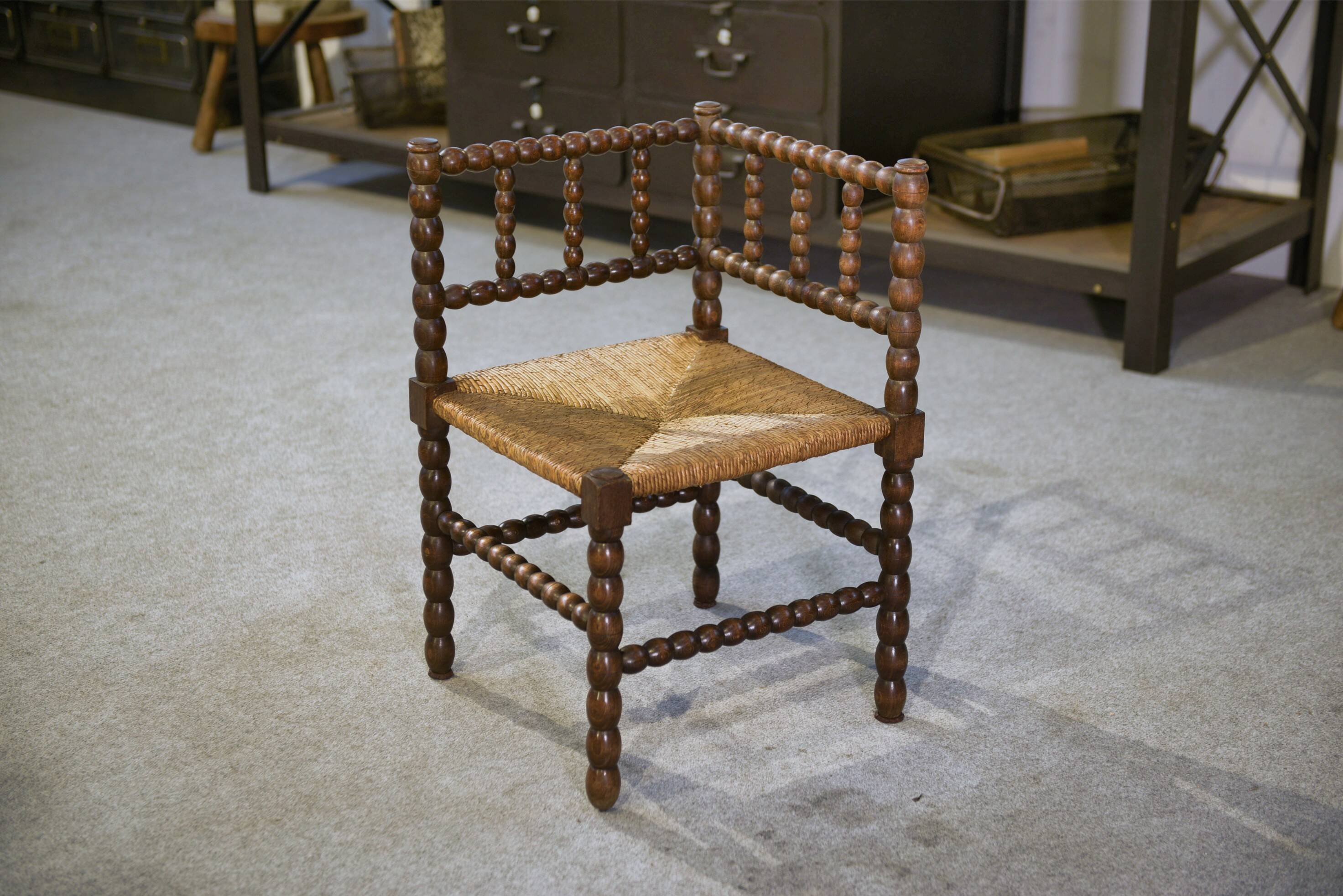 Pair of turned wooden corner chairs from the 1950s.