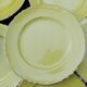 11 yellow earthenware plates from North Orchies