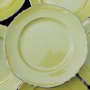 11 yellow earthenware plates from North Orchies