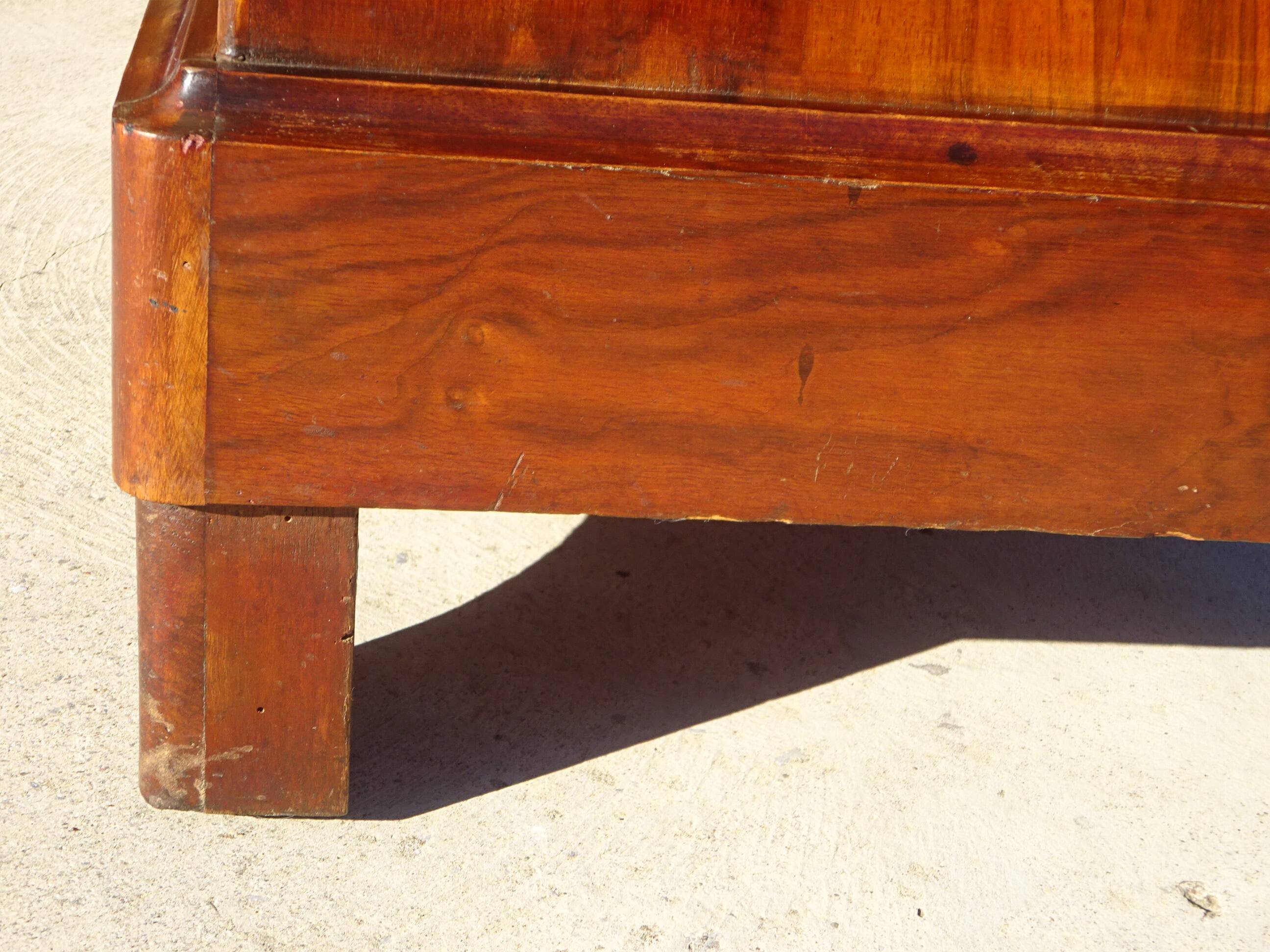 Antique mahogany chest of drawers with white marble.