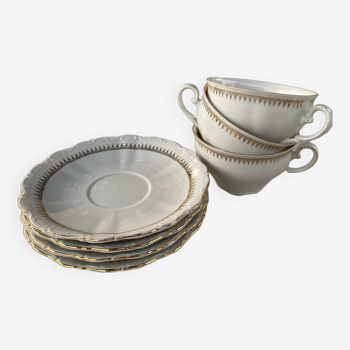 Porcelain cups and saucers with gold decorations