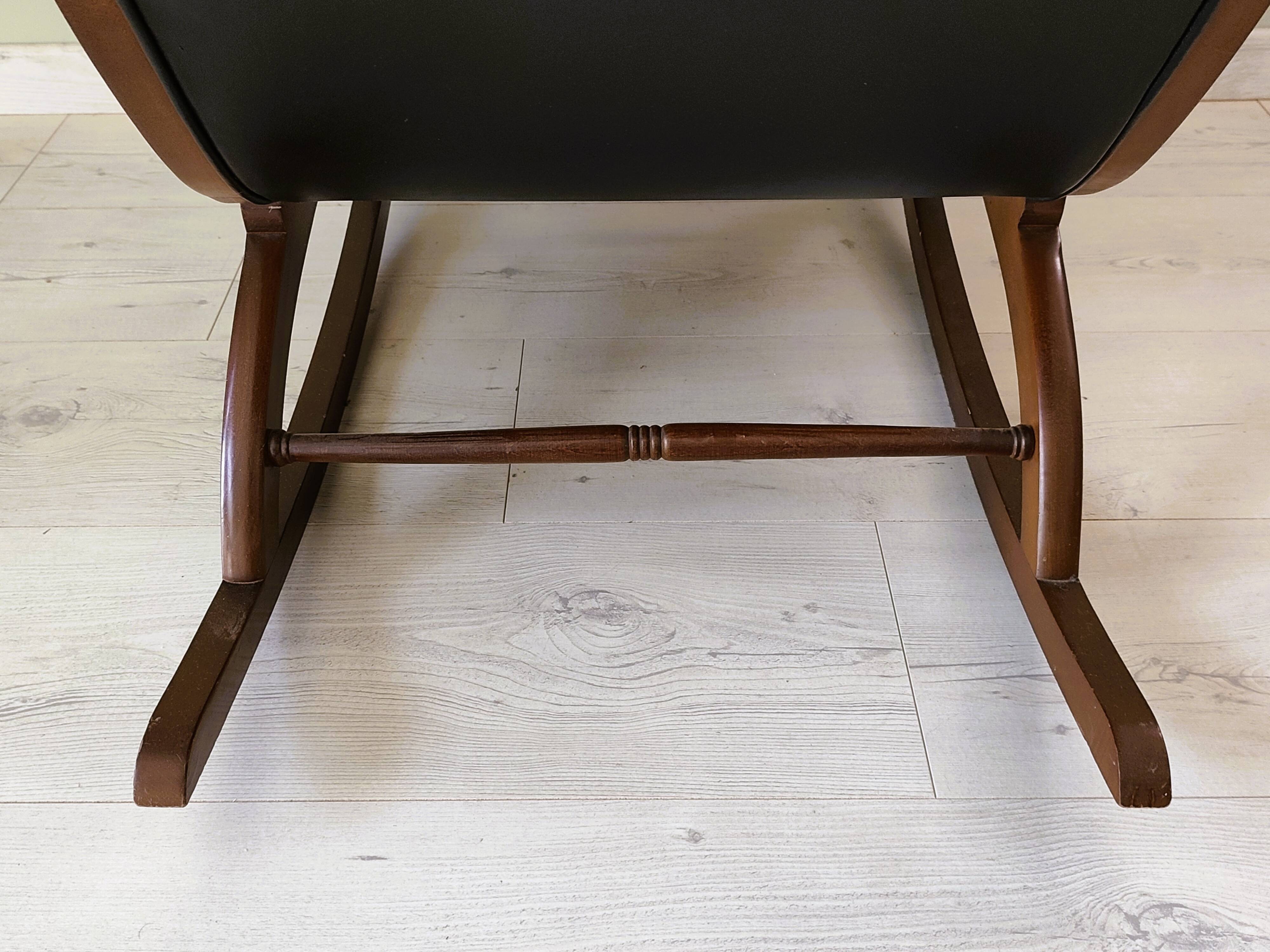 Black leather rocking Chesterfield armchair