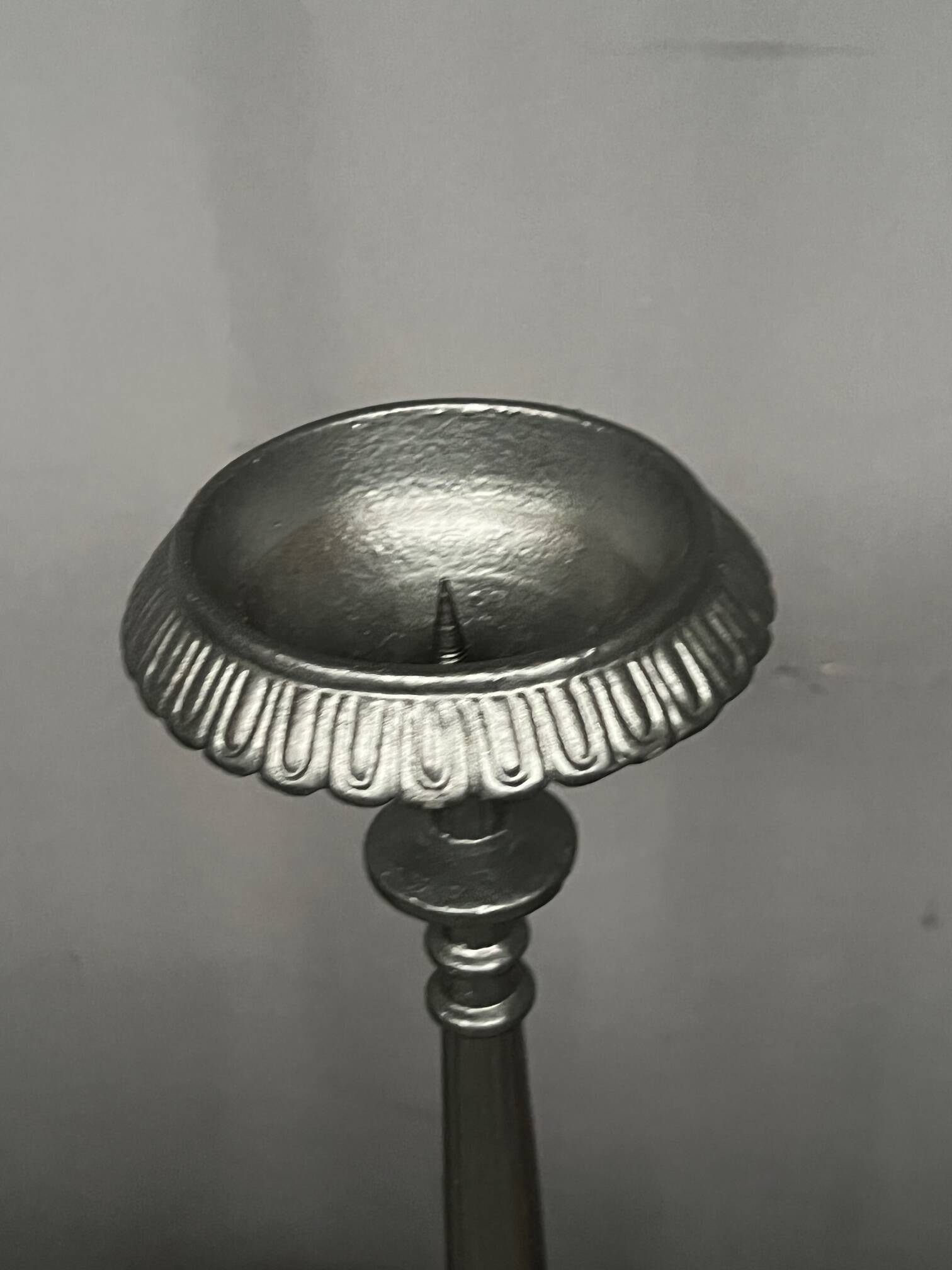 Pair of massive cast iron candlesticks in Renaissance style.