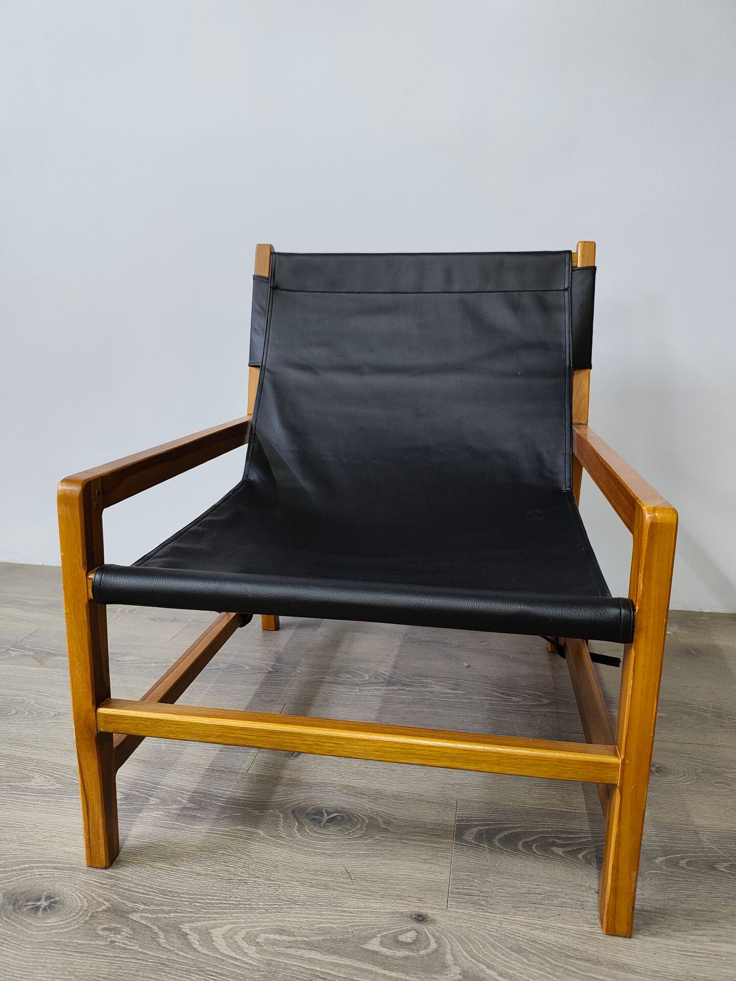 Leather and teak armchair