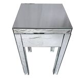 Bedside table covered with beveled mirrors on all sides