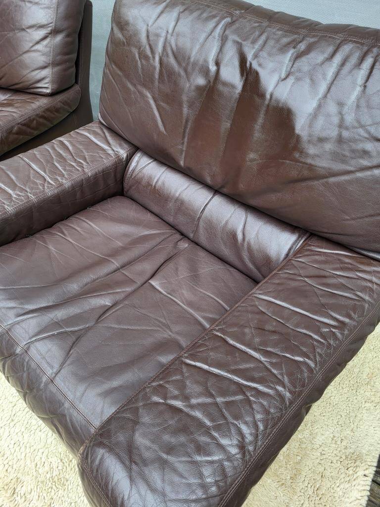 Pair of chocolate leather lounge chairs