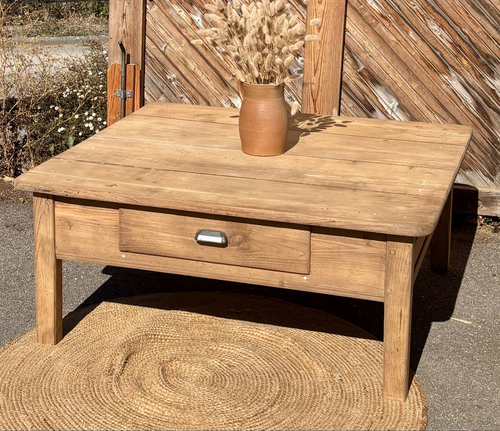 Large square farmhouse coffee table made of raw solid oak.