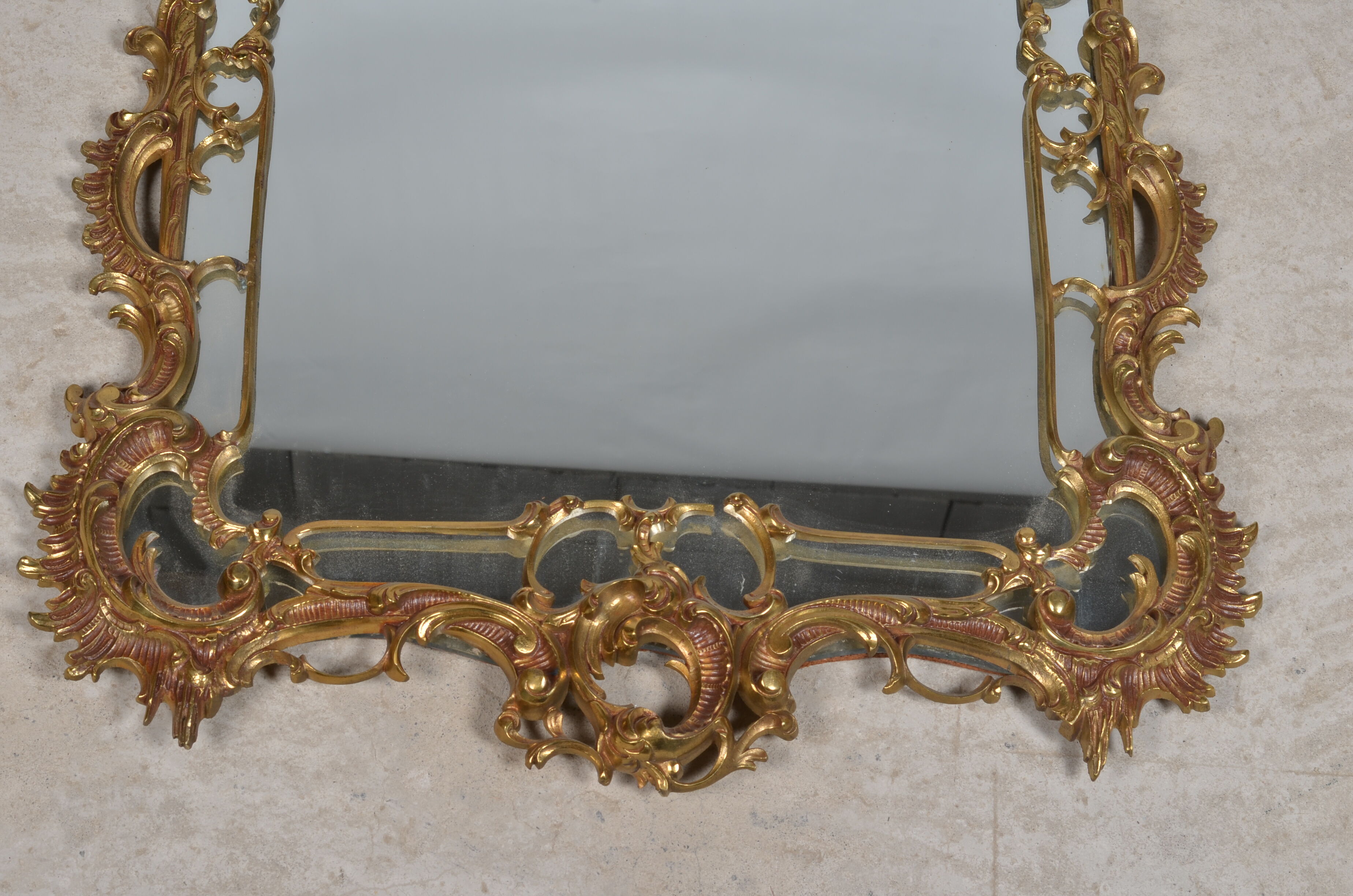 Mirror with baroque style parecloses in bronze 102 x 61 cm
