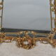 Mirror with baroque style parecloses in bronze 102 x 61 cm