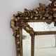 Louis XVI style mirror with parecloses in wood and gilded stucco, 19th century