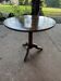Antique round table with floral details.