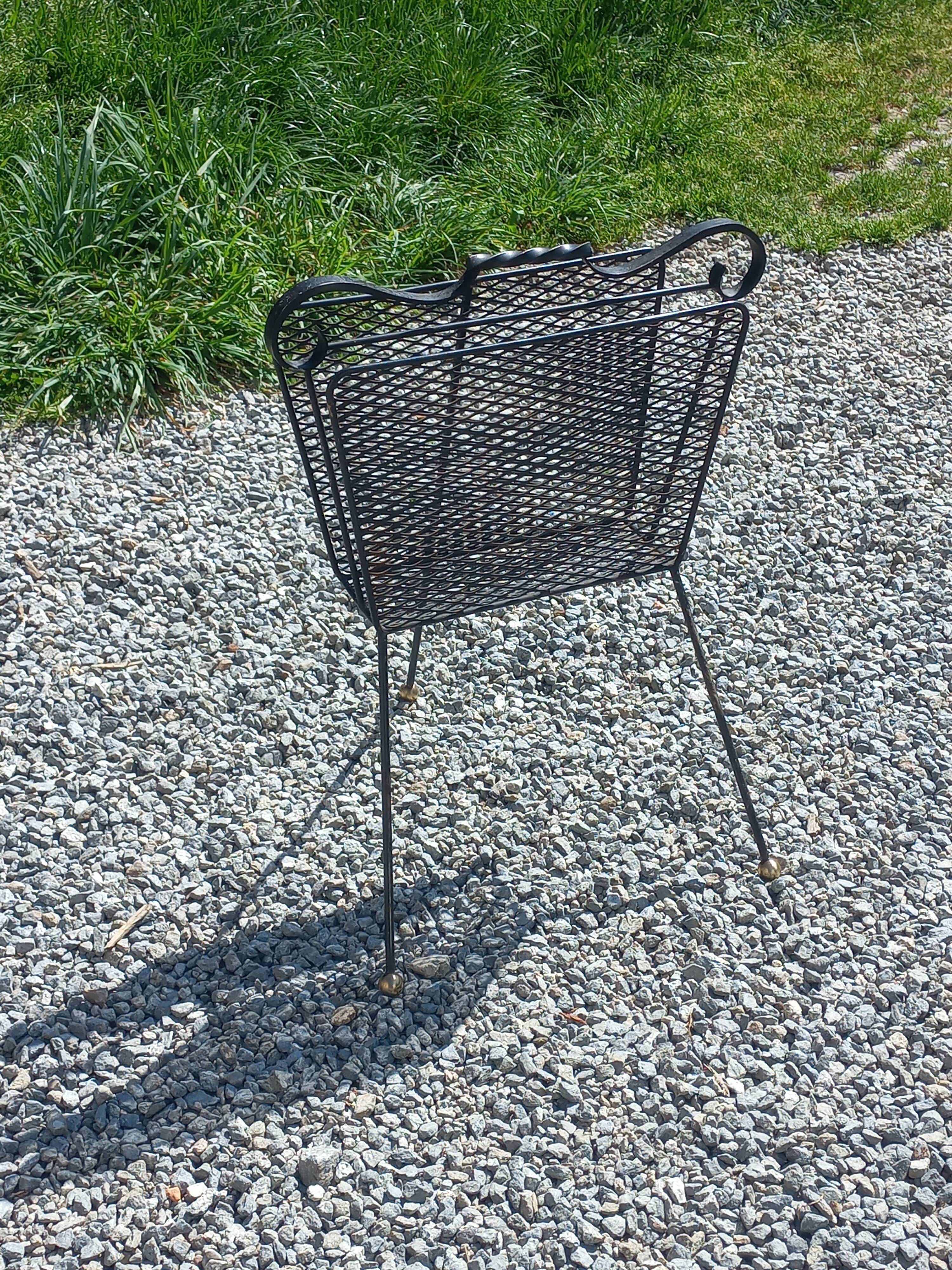 Perforated metal magazine rack from the 1960s.