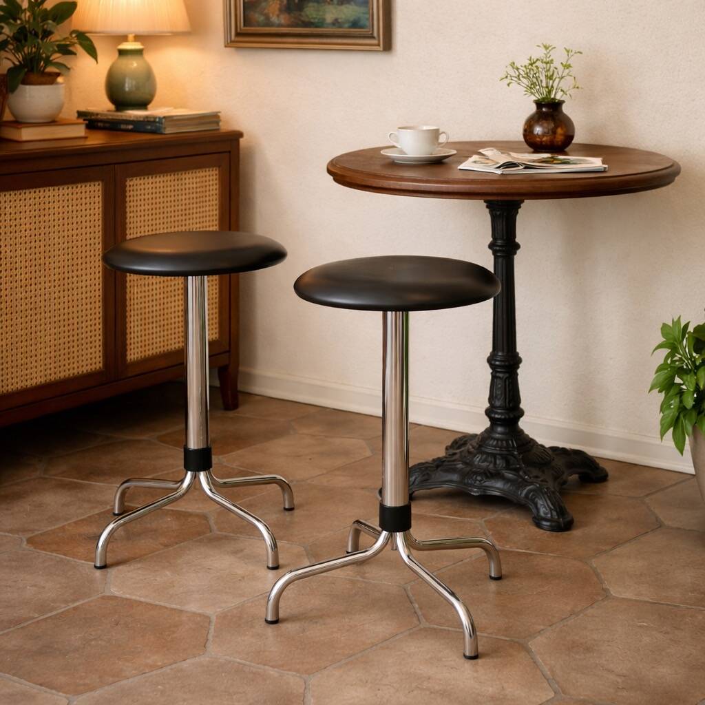 Vintage Brabantia stools in black faux leather and chrome metal – years