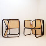 Pair of designer armchairs in curved wood and wicker