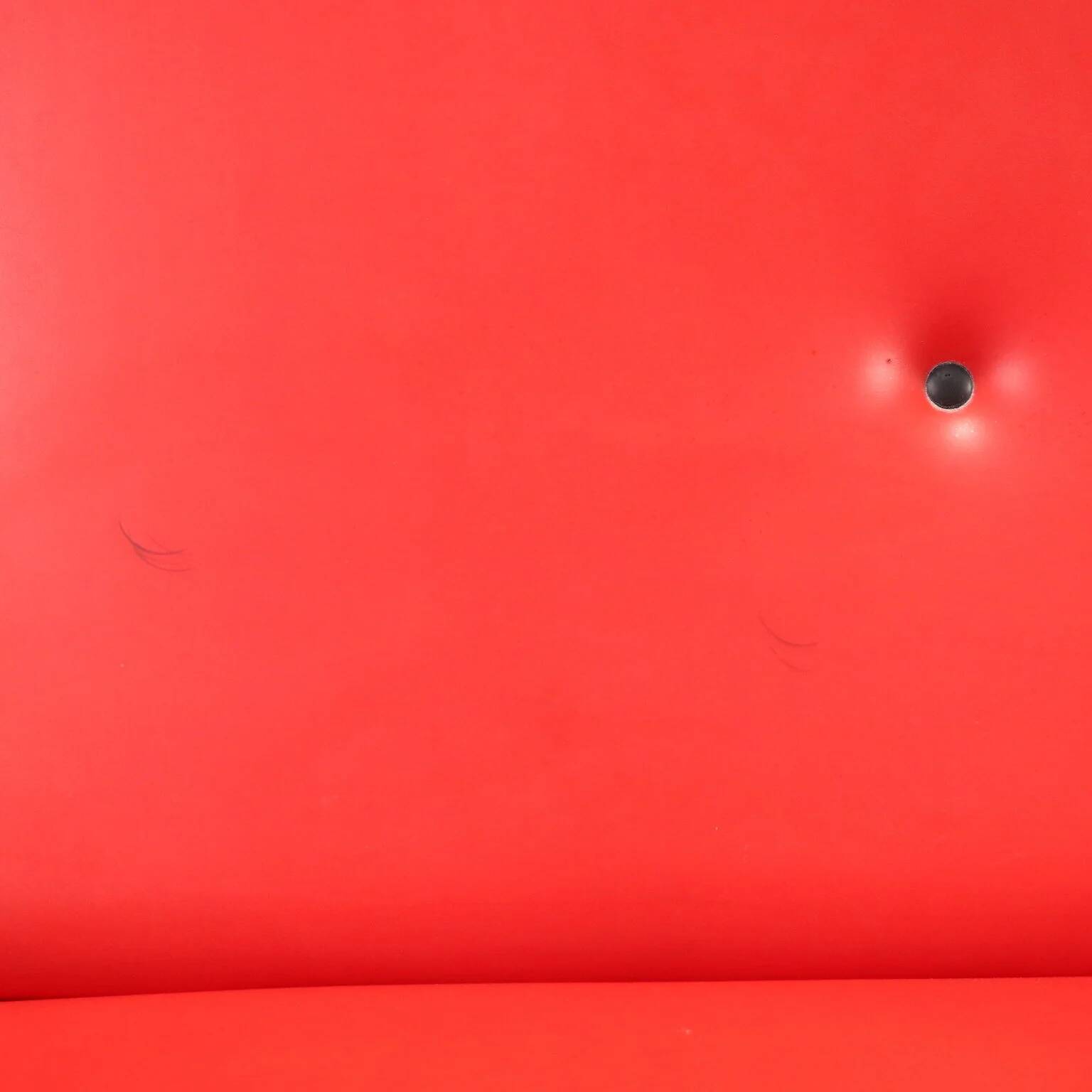 Vintage red faux leather sofa from the 1960s.