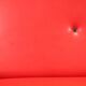 Vintage red faux leather sofa from the 1960s.