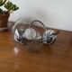 Wall light in chromed metal and smoked grey glass globe