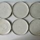 Set of 6 flat plates made of pyrity sandstone, signed