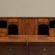 Antique English oak secretary with drop-down front.