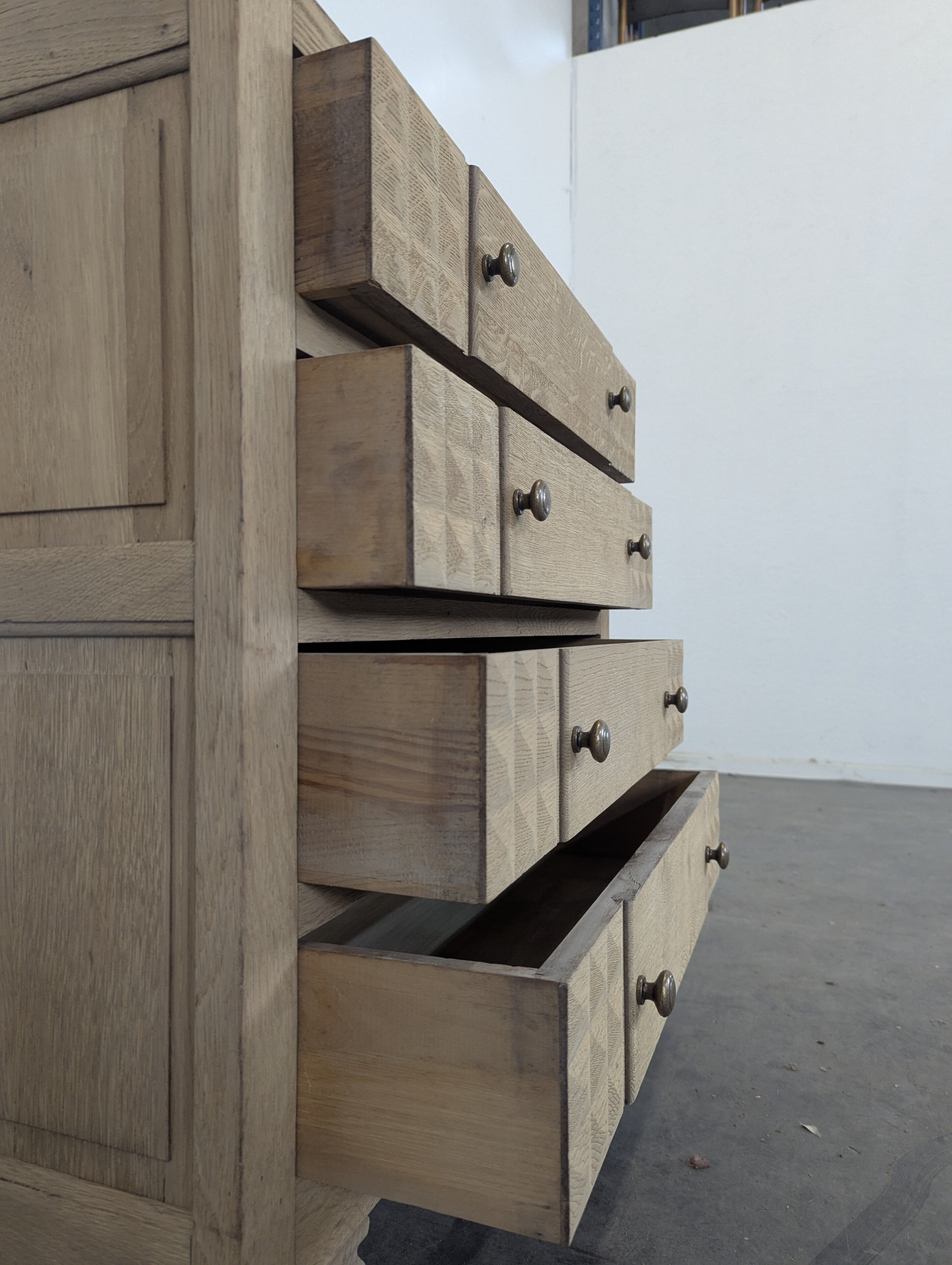 Brutalist commode with stripped diamond tips.