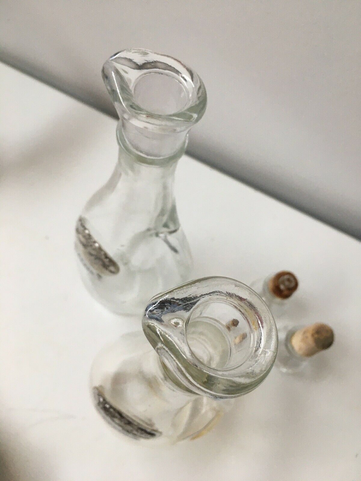 Lot of 2 old glass and tin condiment service bottles and corks