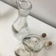 Lot of 2 old glass and tin condiment service bottles and corks